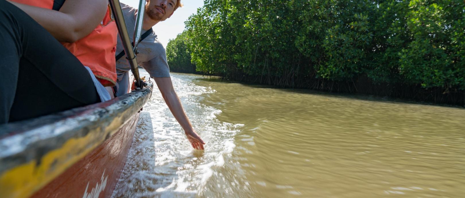 Students boat down river in India during the Sustainable Development Practicum