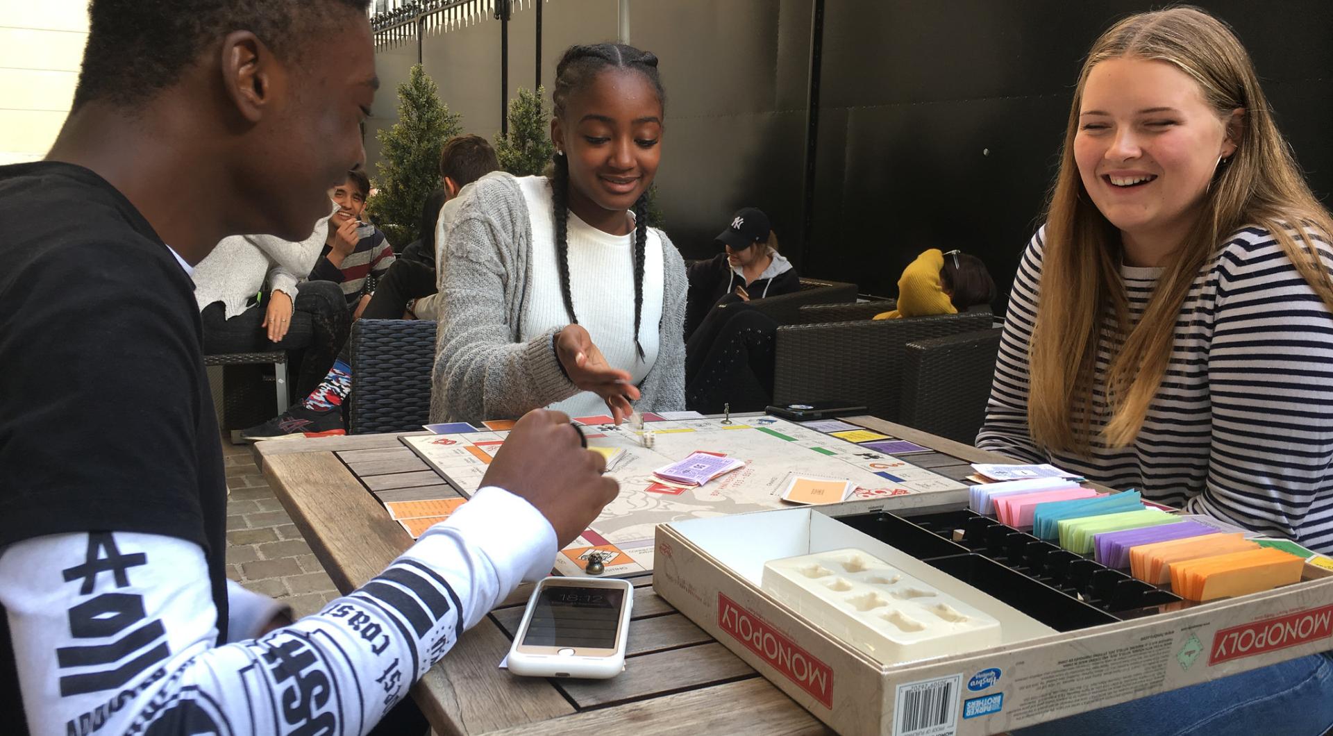 Students play Monopoly outside Combes, 2010s.