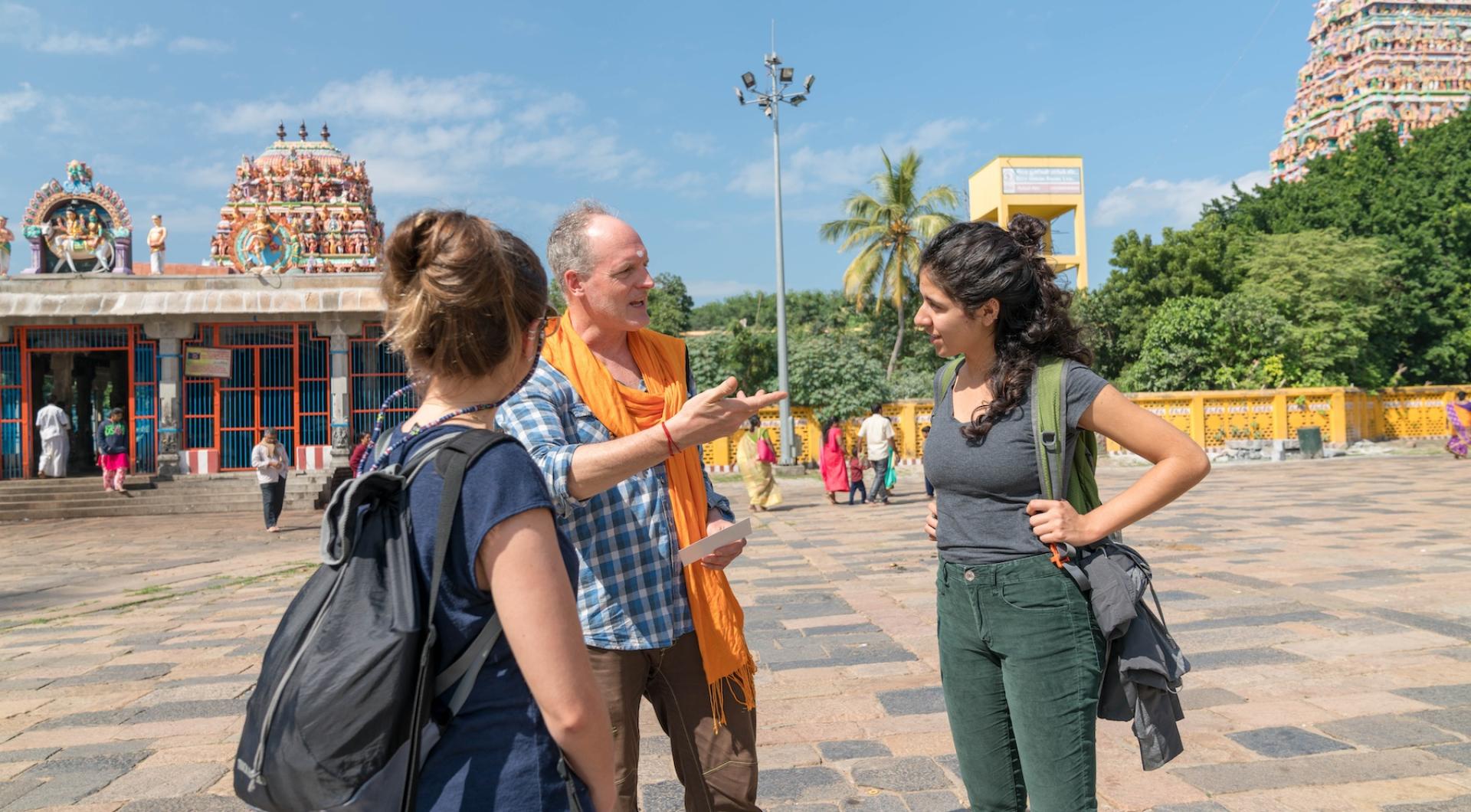 Professor Talcott speaks with two students