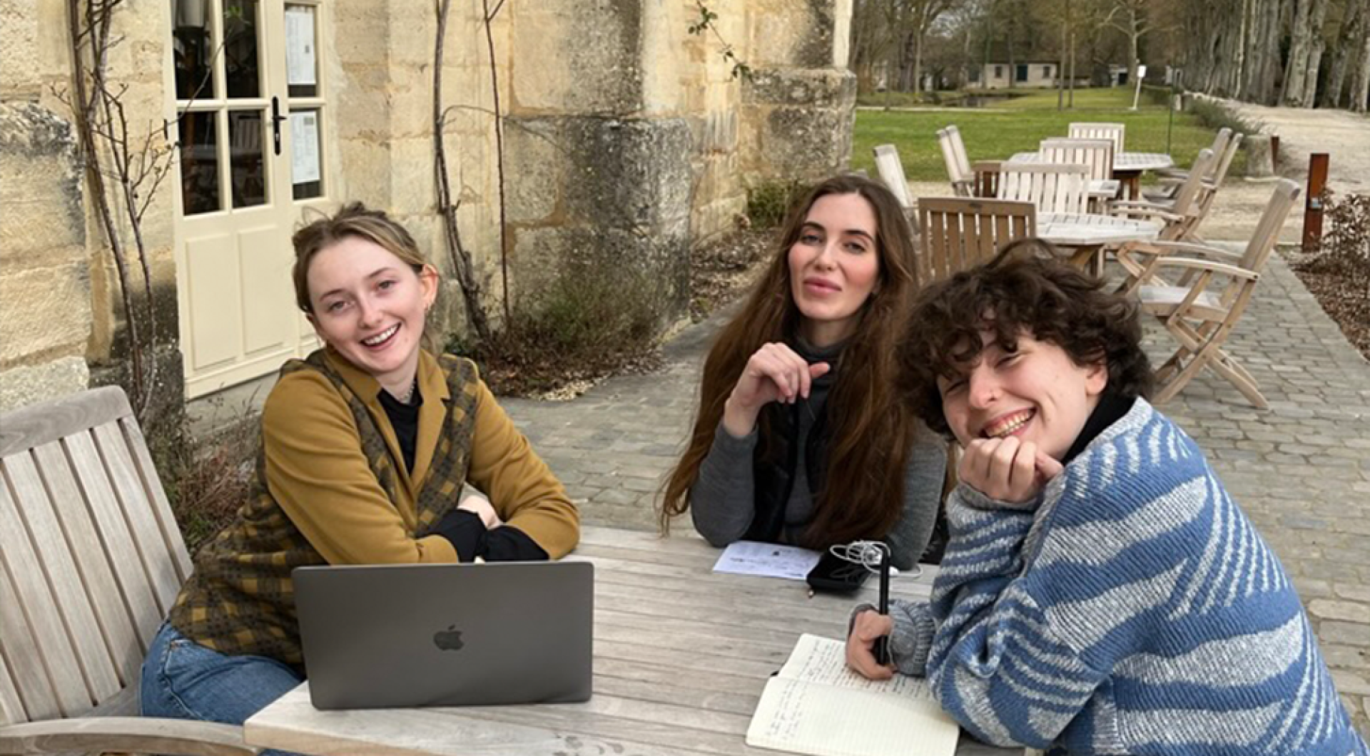 Students work on the terrace at Royaumont