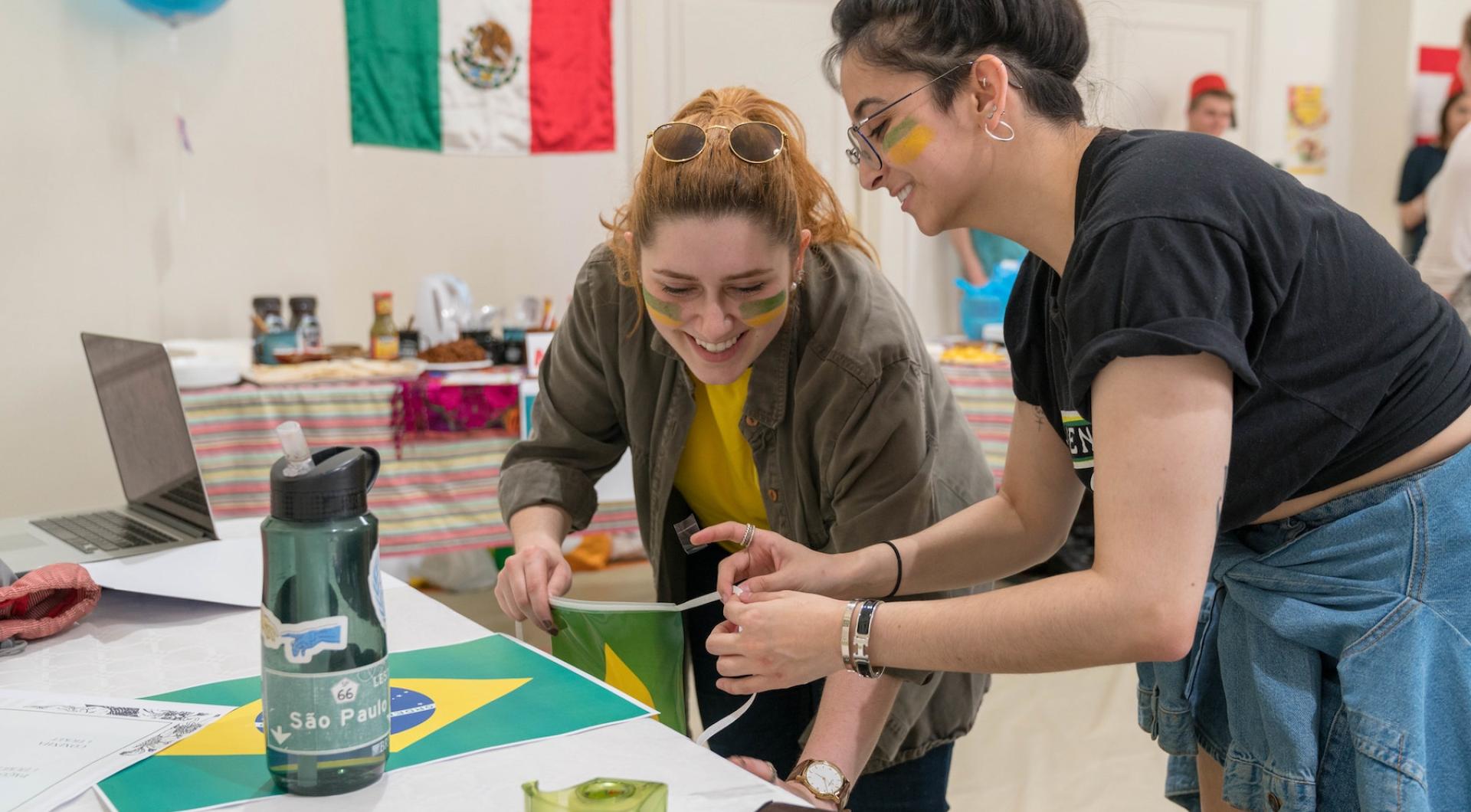 Students prepare a table for the World's Fair